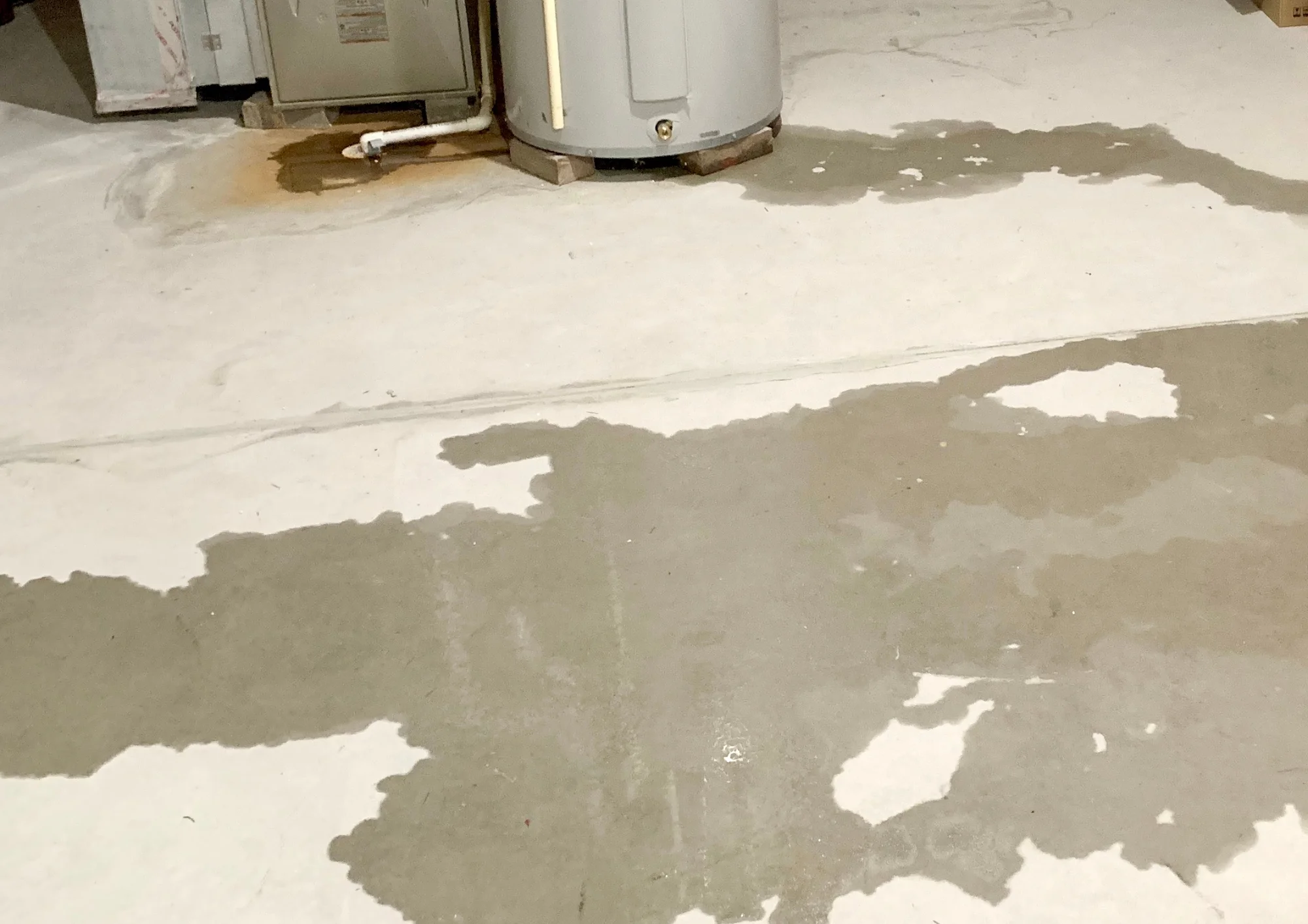Visible slab leak beneath a residential foundation, illustrating warning signs homeowners in Rockwall should watch for